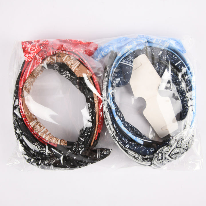 Assorted color bandana headbands with paisley patterns packaged in a 12‚Äëcount set