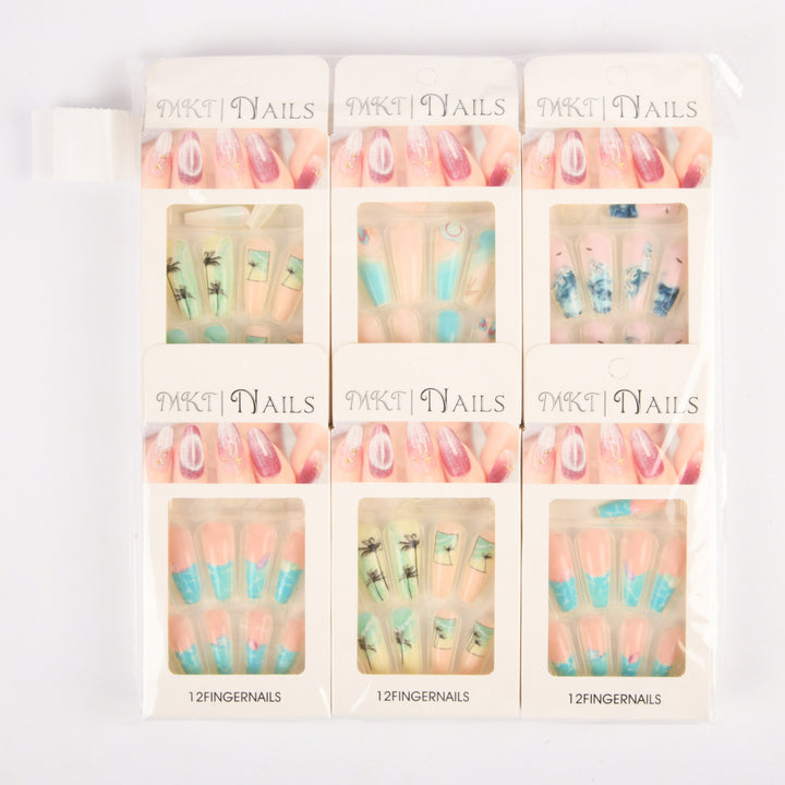 Assorted press‑on nails set with colorful designs displayed in 12 individual packs